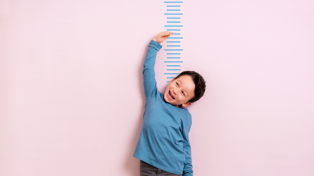 Child measuring his height